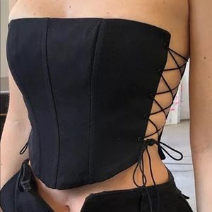 Corset with laced cut out sides